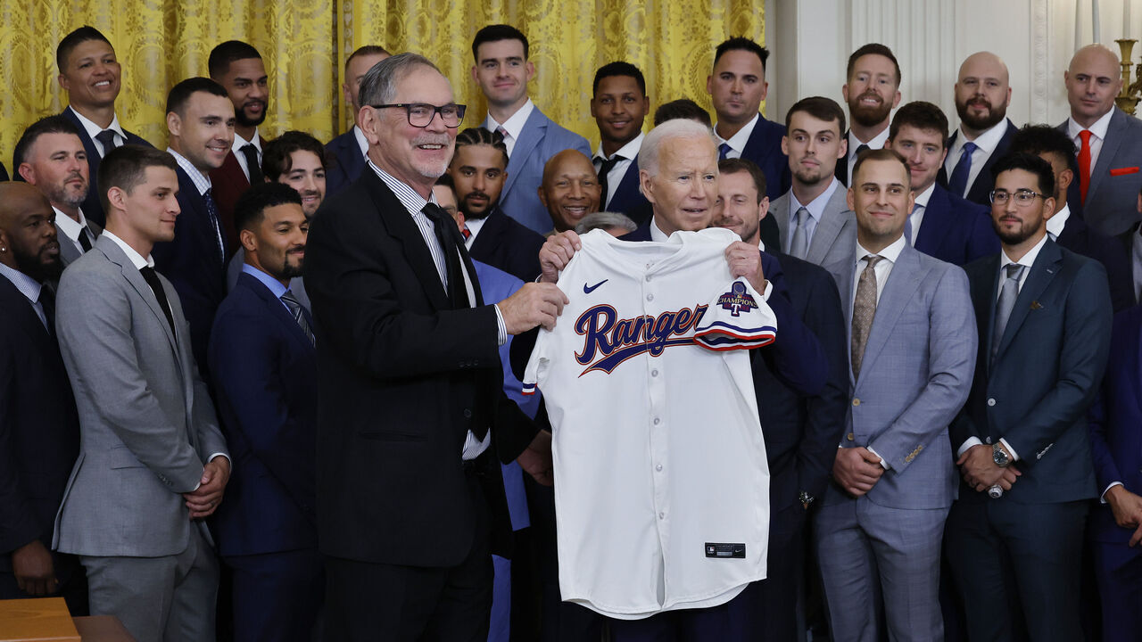 WASHINGTON, DC - AUGUST 08: Texas Rangers Manager Bruce Bochy (L) presents U.S. President Joe Biden with a team jersey during an event to celebrate the team's Major League Baseball 2023 World Series Championship in the East Room at the White House on August 08, 2024 in Washington, DC. The Rangers defeated the Arizona Diamondbacks three games to one to win their franchise's first World Series title in 62 seasons.