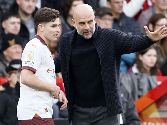 NOTTINGHAM, ENGLAND - APRIL 28: Julian Alvarez of Manchester City and Pep Guardiola, Manager of Manchester City on the side line during the Premier League match between Nottingham Forest and Manchester City at City Ground on April 28, 2024 in Nottingham, England.