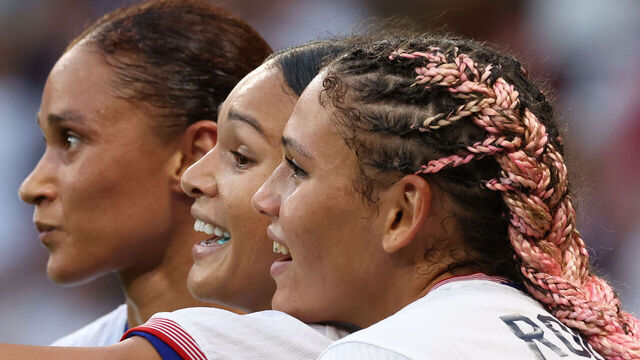 LYON, FRANCE - AUGUST 06: Trinity Rodman, Casey Krueger and Sophia Smith of Team United States celebrate at the end of the Women's semifinal match between United States of America and Germany during the Olympic Games Paris 2024 at Stade de Lyon on August 06, 2024 in Lyon, France.