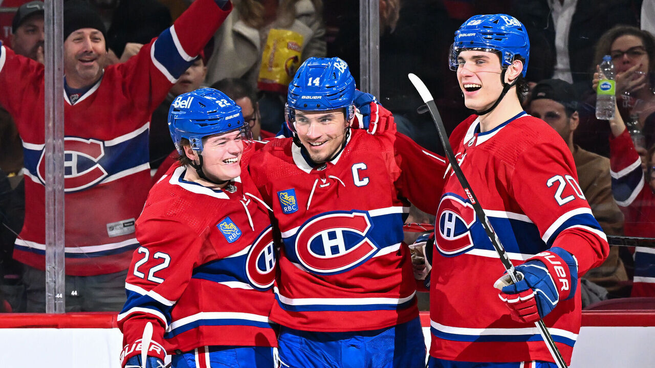 MONTREAL, CANADA - FEBRUARY 10: Nick Suzuki #14 of the Montreal Canadiens celebrates his goal with teammates Cole Caufield #22 (L) and Juraj Slafkovsky #20 (R) during the second period against the Dallas Stars at the Bell Centre on February 10, 2024 in Montreal, Quebec, Canada. The Dallas Stars defeated the Montreal Canadiens 3-2.