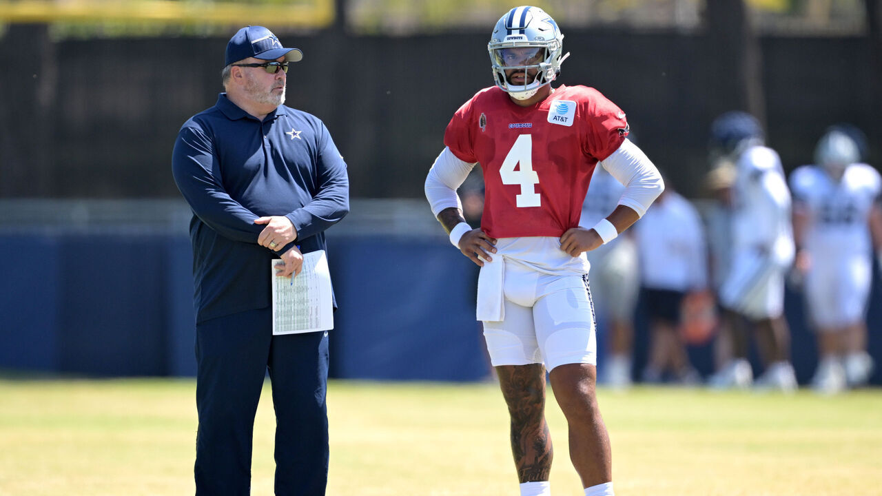 OXNARD, CALIFORNIA - AUGUST 6: Head coach Mike McCarthy and quarterback Dak Prescott #4 of the Dallas Cowboys talks on the field during NFL training camp at River Ridge Fields on August 6, 2024 in Oxnard, California.