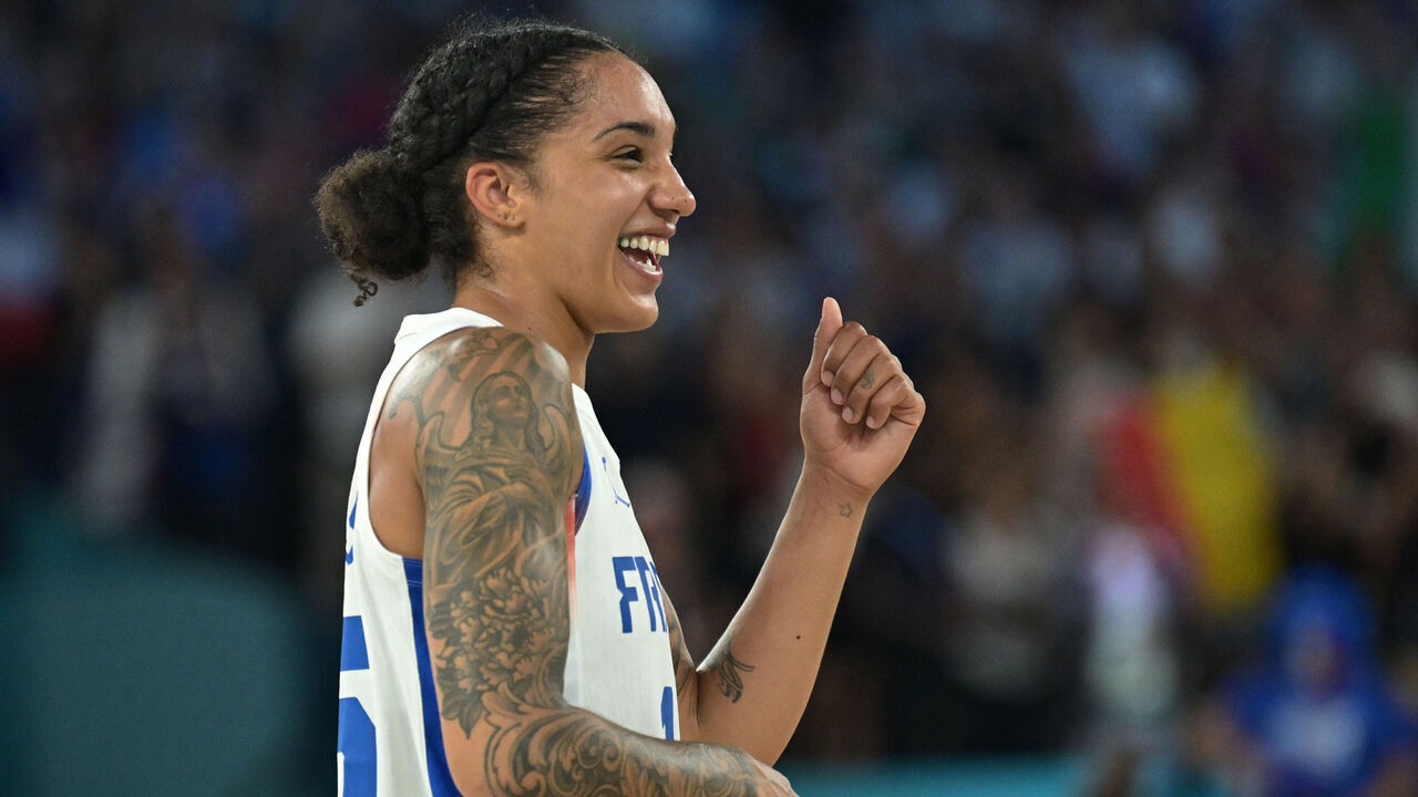 France's #15 Gabby Williams reacts at the end of the women's semifinal basketball match between France and Belgium during the Paris 2024 Olympic Games at the Bercy Arena in Paris on August 9, 2024.