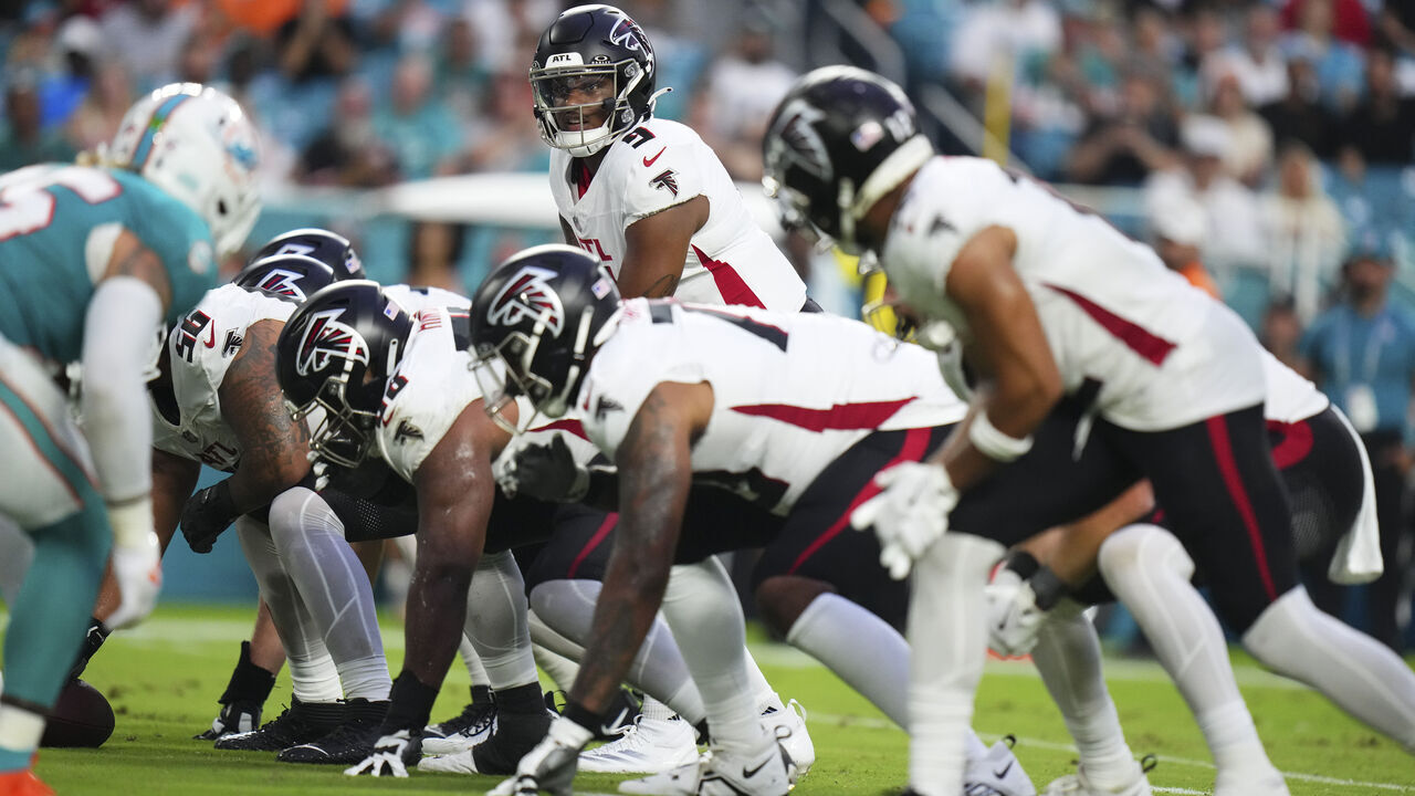 MIAMI GARDENS, FLORIDA - AUGUST 09: Michael Penix Jr. #9 of the Atlanta Falcons calls the snap against the Miami Dolphins during the first quarter in a preseason game at Hard Rock Stadium on August 09, 2024 in Miami Gardens, Florida.