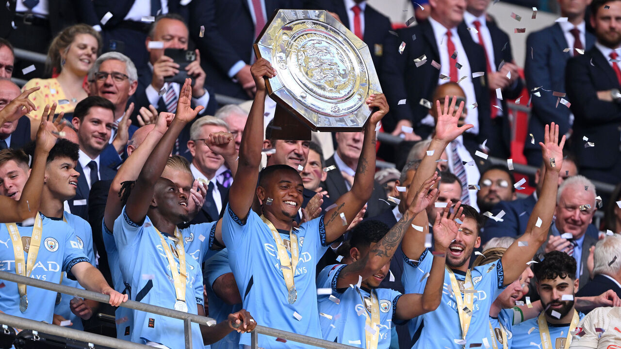 LONDON, ENGLAND - AUGUST 10: Manuel Akanji of Manchester City lifts the FA Community Shield Trophy after their team’s victory during the 2024 FA Community Shield match between Manchester United and Manchester City at Wembley Stadium on August 10, 2024 in London, England.