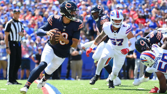 ORCHARD PARK, NEW YORK - AUGUST 10: Caleb Williams #18 of the Chicago Bears runs with the ball as AJ Epenesa #57 of the Buffalo Bills defends during the first half of a preseason game at Highmark Stadium on August 10, 2024 in Orchard Park, New York.