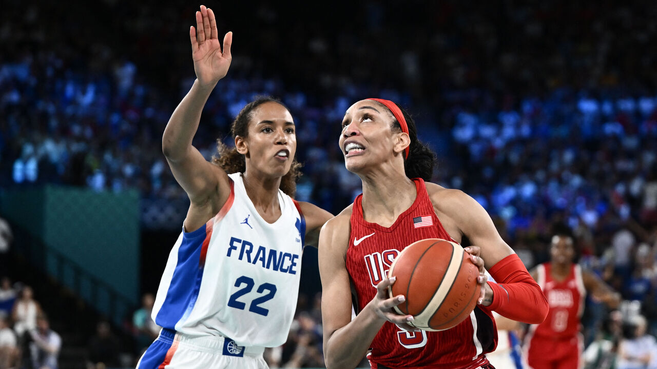 France's #22 Marieme Badiane (L) defends against USA's #09 A'ja Wilson in the women's Gold Medal basketball match between France and the USA during the Paris 2024 Olympic Games at the Bercy Arena in Paris on August 11, 2024.