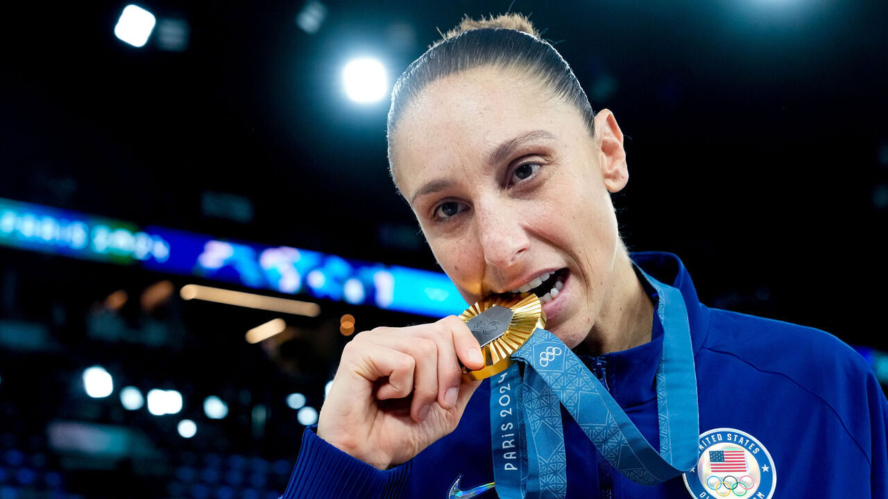 PARIS, FRANCE - AUGUST 11: Diana Taurasi of United States pose with her gold medal after winning the Women's Gold Medal Game, Game 52, France vs United States of America on day sixteen of the Olympic Games Paris 2024 at Arena Bercy on August 11, 2024 in Paris, France.