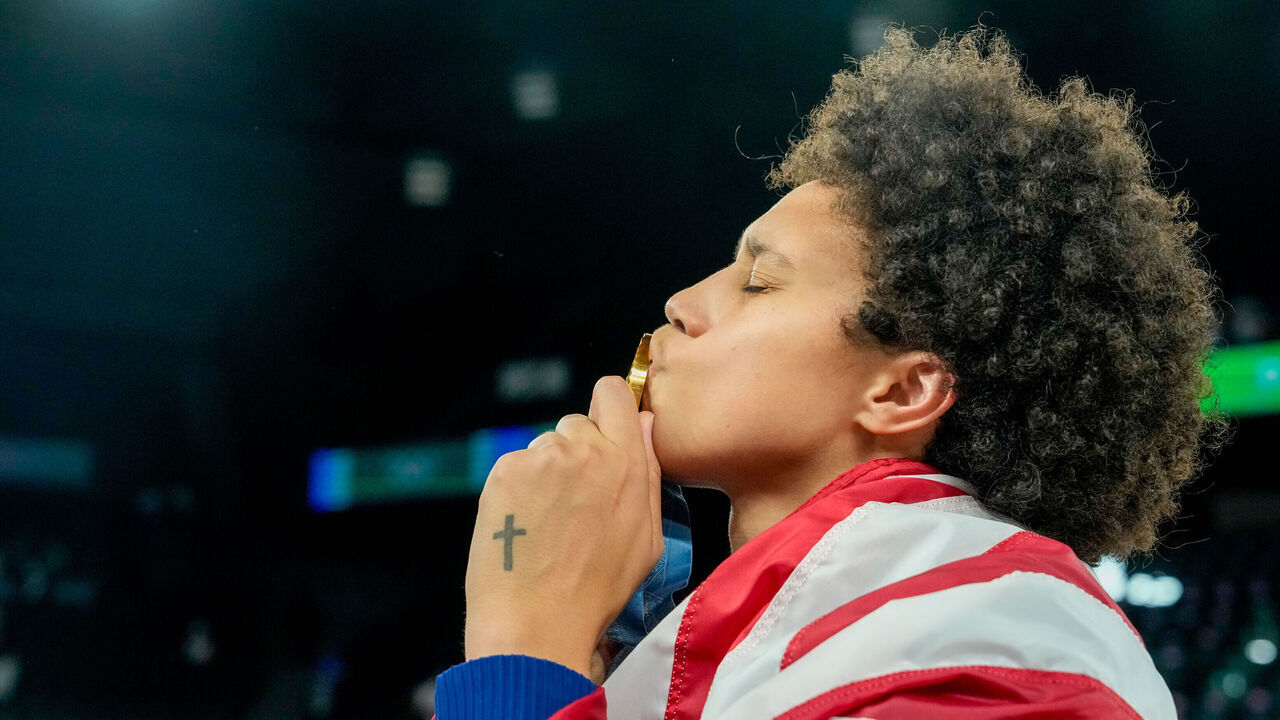 PARIS, FRANCE - AUGUST 11: Brittney Griner of United States kisses her gold medal after winning the Women's Gold Medal Game, Game 52, France vs United States of America on day sixteen of the Olympic Games Paris 2024 at Arena Bercy on August 11, 2024 in Paris, France.