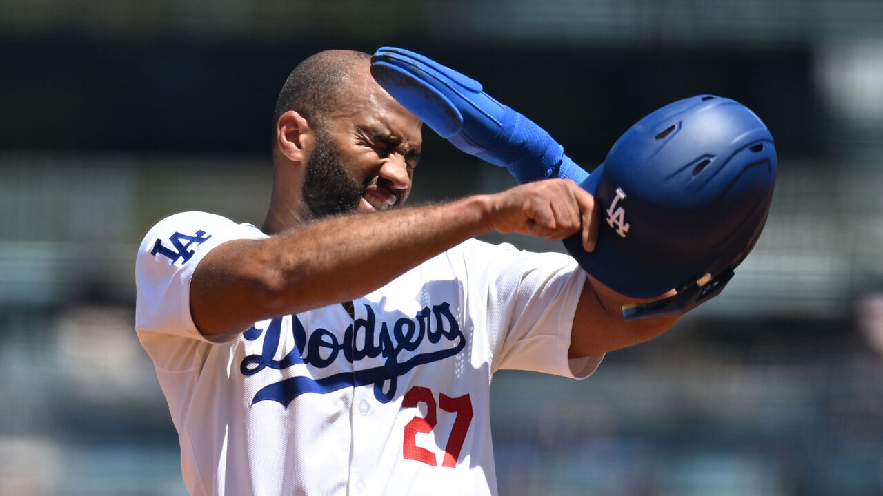 LOS ANGELES, CALIFORNIA - AUGUST 11: Amed Rosario #27 of the Los Angeles Dodgers wipes away sweat while standing on second base in the first inning against the Pittsburgh Pirates at Dodger Stadium on August 11, 2024 in Los Angeles, California.