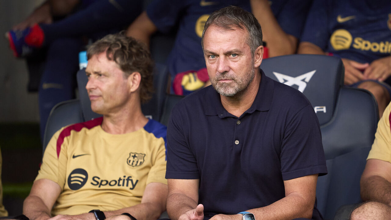 BARCELONA, SPAIN - AUGUST 12: Hansi Flick, Manager of FC Barcelona looks on from the bench prior to the Trofeu Joan Gamper match between FC Barcelona and AS Monaco at Estadi Olimpic Lluis Companys on August 12, 2024 in Barcelona, Spain.