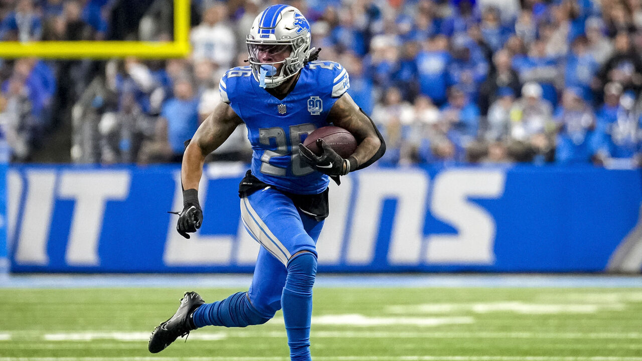 DETROIT, MICHIGAN - JANUARY 21: Jahmyr Gibbs #26 of the Detroit Lions runs the ball against the Tampa Bay Buccaneers at Ford Field on January 21, 2024 in Detroit, Michigan.