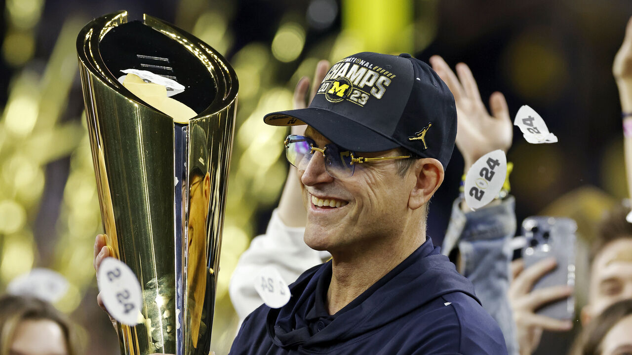 HOUSTON, TX - JANUARY 08: Michigan Wolverines head coach Jim Harbaugh celebrates following the CFP National Championship against the Washington Huskies on January 08, 2024 at NRG Stadium in Houston, Texas.
