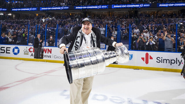 TAMPA, FL - JULY 7: Chairman and Governor Jeff Vinik of the Tampa Bay Lightning hoists the Stanley Cup overhead after the Tampa Bay Lightning defeated the Montreal Canadiens in Game Five to win the best of seven game series 4-1 during the Stanley Cup Final of the 2021 Stanley Cup Playoffs at Amalie Arena on July 7, 2021 in Tampa, Florida.