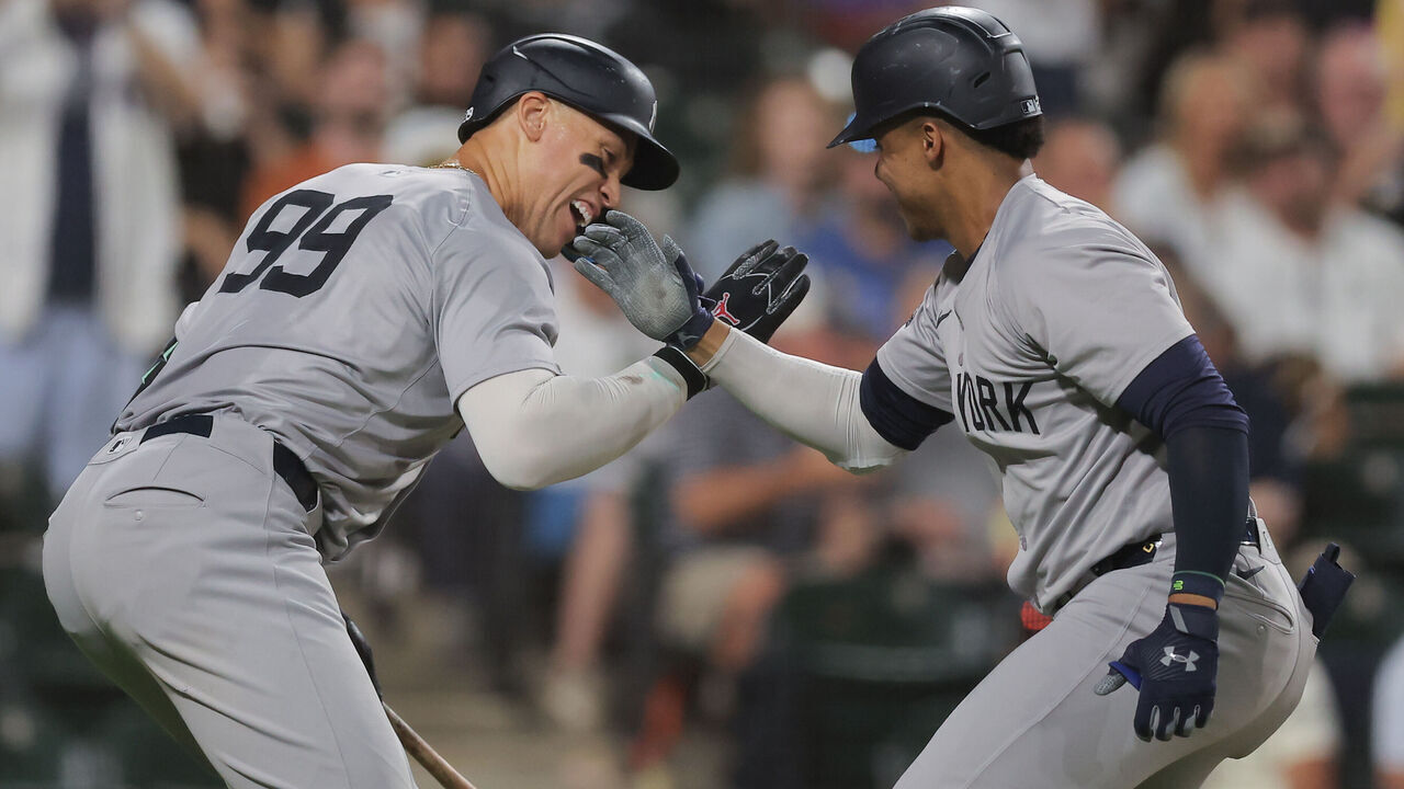 CHICAGO, IL - AUGUST 13: Juan Soto #22 of the New York Yankees celebrates with Aaron Judge #99 of the New York Yankees after hitting a home run during the fifth inning of a baseball game against the Chicago White Sox on August 13, 2024 at Guaranteed Rate Field in Chicago,Illinois.