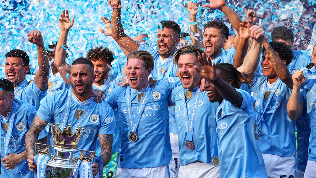 MANCHESTER, ENGLAND - MAY 19: Kyle Walker of Manchester City lifts the Premier League trophy with team mates for a record fourth consecutive time during the Premier League match between Manchester City and West Ham United at Etihad Stadium on May 19, 2024 in Manchester, England.