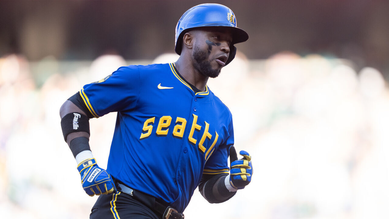 SEATTLE, WA - AUGUST 02: Victor Robles #10 of the Seattle Mariners rounds the bases after hitting a solo home run during the first inning of a game against the Philadelphia Phillies at T-Mobile Park on August 2, 2024 in Seattle, Washington.