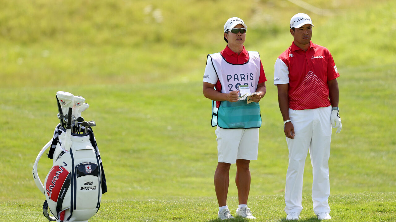 PARIS, FRANCE - AUGUST 04: Hideki Matsuyama of Team Japan looks across the sixth hole alongside his caddie, Shota Hayafuji during Day Four of the Men's Individual Stroke Play on day nine of the Olympic Games Paris 2024 at Le Golf National on August 04, 2024 in Paris, France.