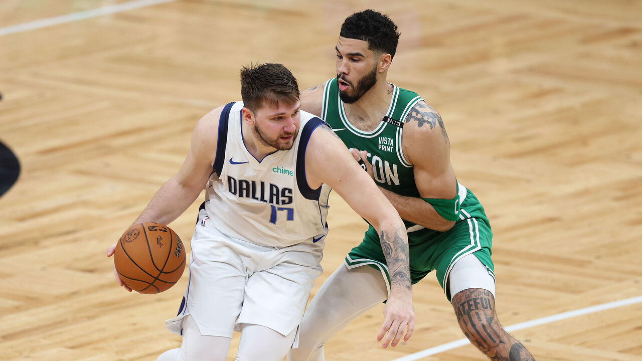 BOSTON, MASSACHUSETTS - JUNE 17: Luka Doncic #77 of the Dallas Mavericks drives past Jayson Tatum #0 of the Boston Celtics during the third quarter of Game Five of the 2024 NBA Finals at TD Garden on June 17, 2024 in Boston, Massachusetts.