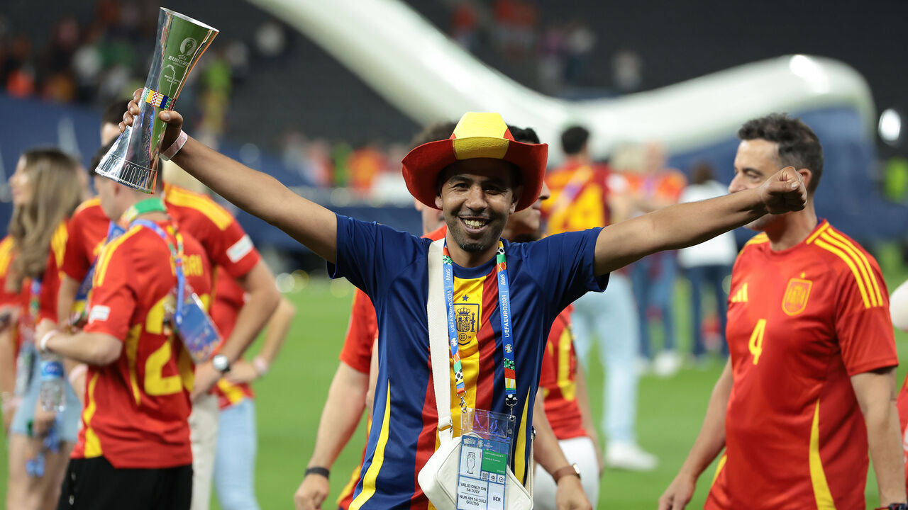BERLIN, GERMANY - JULY 14: Mounir Nasraoui the father of Lamine Yamal of Spain celebrates with his son's Young Player of the Tournament award following the 2-1 victory in the UEFA EURO 2024 final match between Spain and England at Olympiastadion on July 14, 2024 in Berlin, Germany.