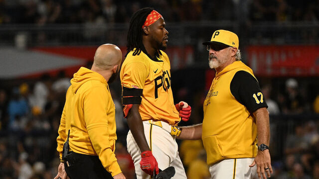 PITTSBURGH, PENNSYLVANIA - AUGUST 16: Oneil Cruz #15 of the Pittsburgh Pirates is checked on by manager Derek Shelton #17 and a trainer after an apparent injury in the seventh inning during the game against the Seattle Mariners at PNC Park on August 16, 2024 in Pittsburgh, Pennsylvania.