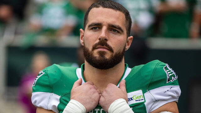 REGINA, CANADA - AUGUST 20: Thomas Bertrand-Hudlooks on from #30 of the Saskatchewan Roughriders looks on from the sideline before the game between the BC Lions and Saskatchewan Roughriders at Mosaic Stadium looks on from August 20, 2023 in Regina, Canada.