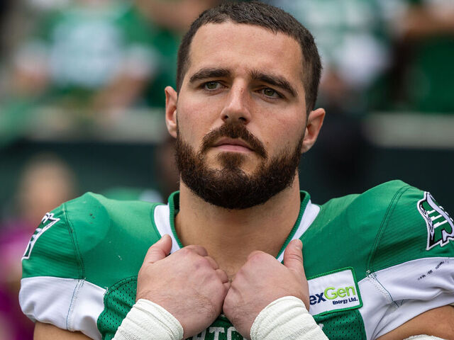 REGINA, CANADA - AUGUST 20: Thomas Bertrand-Hudlooks on from #30 of the Saskatchewan Roughriders looks on from the sideline before the game between the BC Lions and Saskatchewan Roughriders at Mosaic Stadium looks on from August 20, 2023 in Regina, Canada.