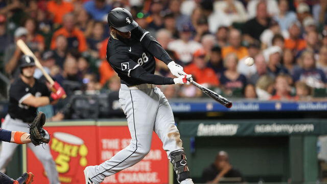 HOUSTON, TEXAS - AUGUST 16: Luis Robert Jr. #88 of the Chicago White Sox hits a solo home run in the fifth inning against the Houston Astros at Minute Maid Park on August 16, 2024 in Houston, Texas.