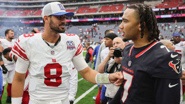 HOUSTON, TEXAS - AUGUST 17: Daniel Jones #8 of the New York Giants talks with C.J. Stroud #7 of the Houston Texans after the preseason game at NRG Stadium on August 17, 2024 in Houston, Texas.
