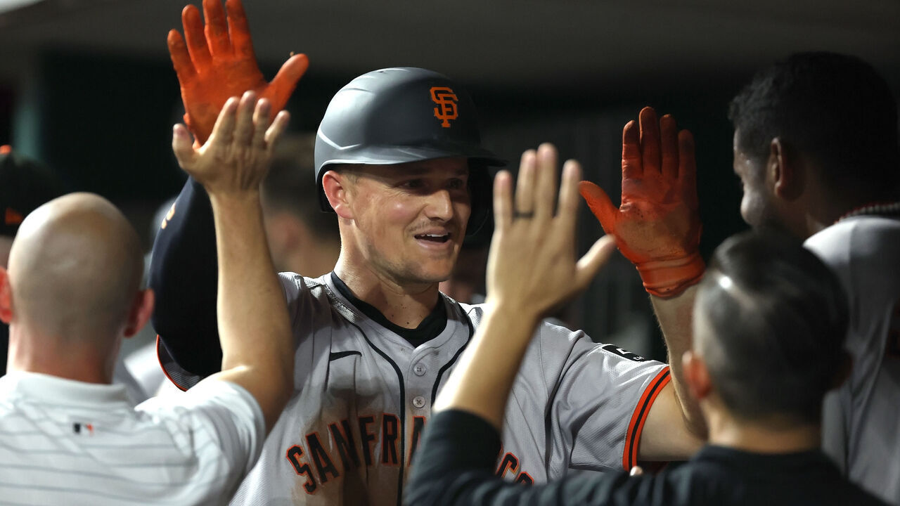 CINCINNATI, OHIO - AUGUST 3: Matt Chapman #26 of the San Francisco Giants is congratulated by his teammates after hitting a home run in the ninth inning of the game against the Cincinnati Reds at Great American Ball Park on August 3, 2024 in Cincinnati, Ohio. Cincinnati defeated San Francisco 6-4.