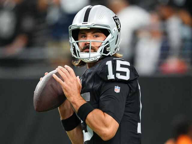 LAS VEGAS, NEVADA - AUGUST 17: Quarterback Gardner Minshew #15 of the Las Vegas Raiders warms up before a preseason game against the Dallas Cowboys at Allegiant Stadium on August 17, 2024 in Las Vegas, Nevada.
