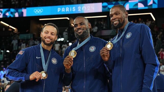 Stephen Curry L, LeBron James C and Kevin Durant of gold medalists team USA attends the victory ceremony for the men's basketball at the Paris 2024 Olympic Games in Paris, France, Aug. 10, 2024.
