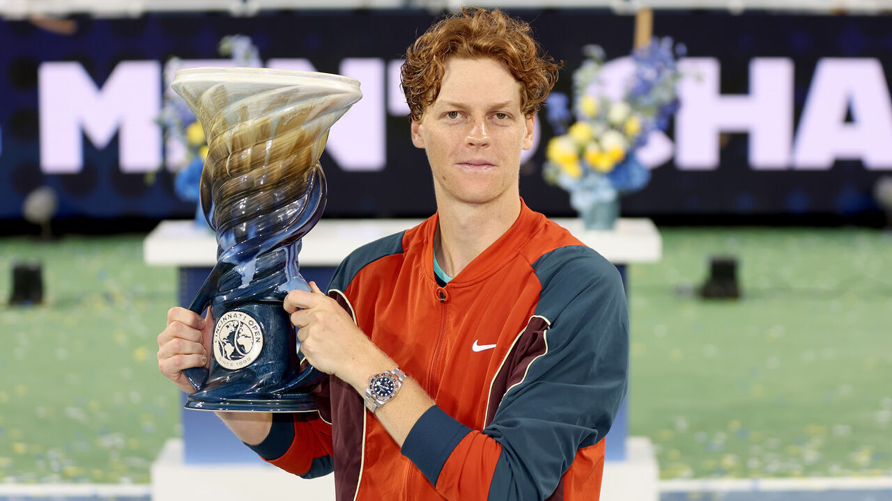 MASON, OHIO - AUGUST 19: Jannik Sinner of Italy poses with the Rookwood Cup after defeating Frances Tiafoe of the United States during the men's final of the Cincinnati Open at the Lindner Family Tennis Center on August 19, 2024 in Mason, Ohio.