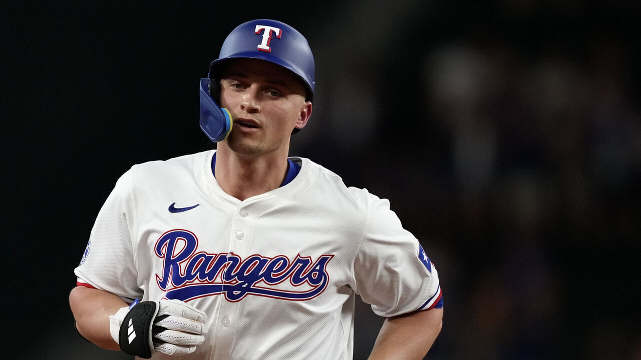 ARLINGTON, TEXAS - AUGUST 19: Corey Seager #5 of the Texas Rangers runs the bases after hitting a solo home run during the first inning against the Pittsburgh Pirates at Globe Life Field on August 19, 2024 in Arlington, Texas.