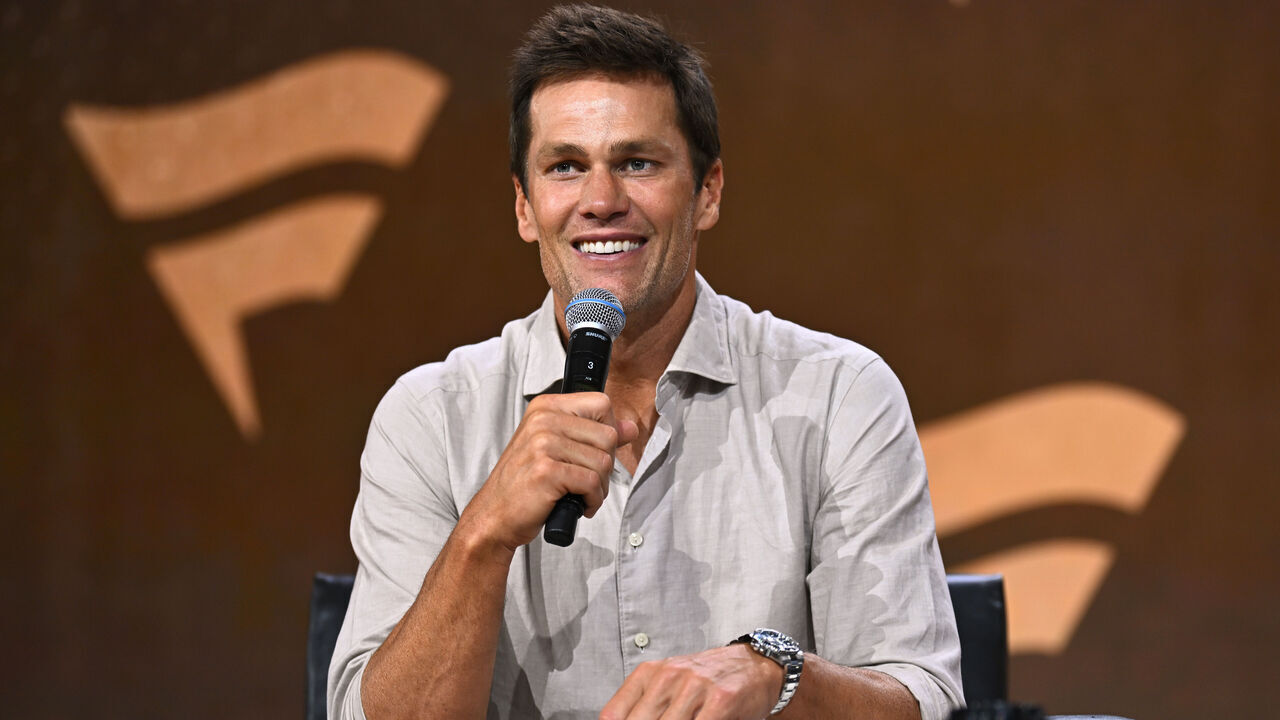 NEW YORK, NEW YORK - AUGUST 16: Tom Brady speaks at the Fanatics Fest NYC 2024 at Jacob Javits Center on August 16, 2024 in New York City.