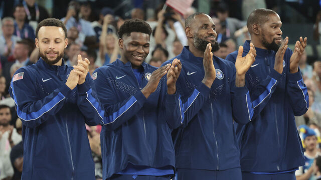 PARIS, FRANCE - AUGUST 10: Stephen Curry #4, LeBron James #6, Anthony Edwards #5 and Kevin Durant #7 of Team United States celebrate on the podium during the Men's basketball medal ceremony on day fifteen of the Olympic Games Paris 2024 at Bercy Arena on August 10, 2024 in Paris, France.
