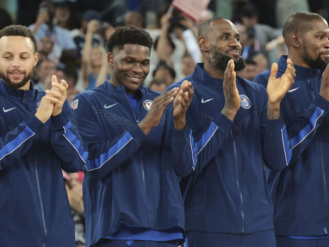 PARIS, FRANCE - AUGUST 10: Stephen Curry #4, LeBron James #6, Anthony Edwards #5 and Kevin Durant #7 of Team United States celebrate on the podium during the Men's basketball medal ceremony on day fifteen of the Olympic Games Paris 2024 at Bercy Arena on August 10, 2024 in Paris, France.