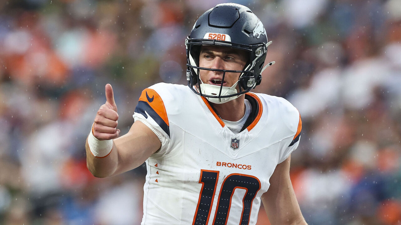 DENVER, CO - AUGUST 18: Bo Nix #10 of the Denver Broncos makes a call during an NFL football game against the Green Bay Packers at Empower Field at Mile High on August 18, 2024 in Denver, CO.