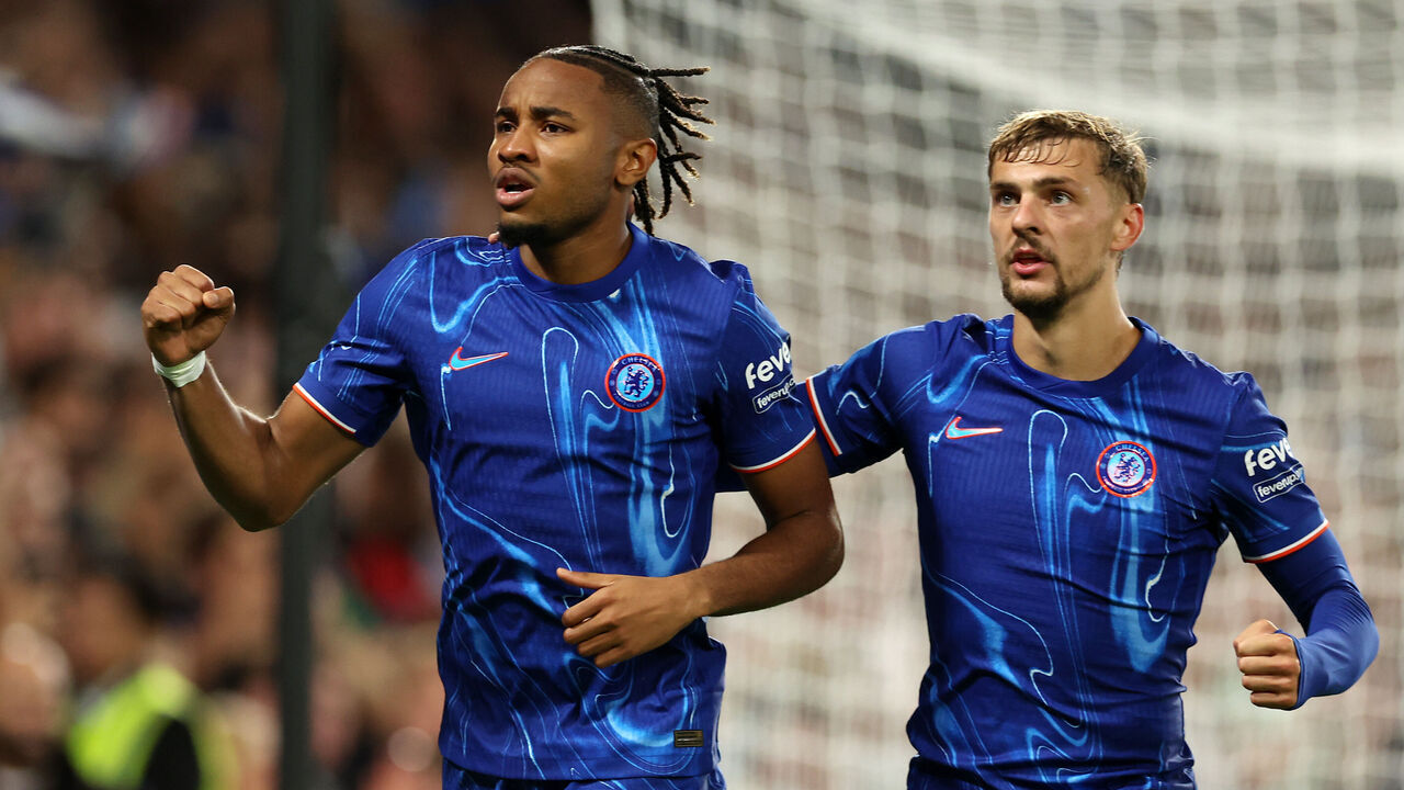 LONDON, ENGLAND - AUGUST 22: Christopher Nkunku of Chelsea celebrates scoring his team's first goal from the penalty spot, after he was fouled by Jeremy Frick of Servette (not pictured) with teammate Kiernan Dewsbury-Hall during the UEFA Europa Conference League Play-Off 1st leg match between Chelsea v Servette FC at Stamford Bridge on August 22, 2024 in London, England.