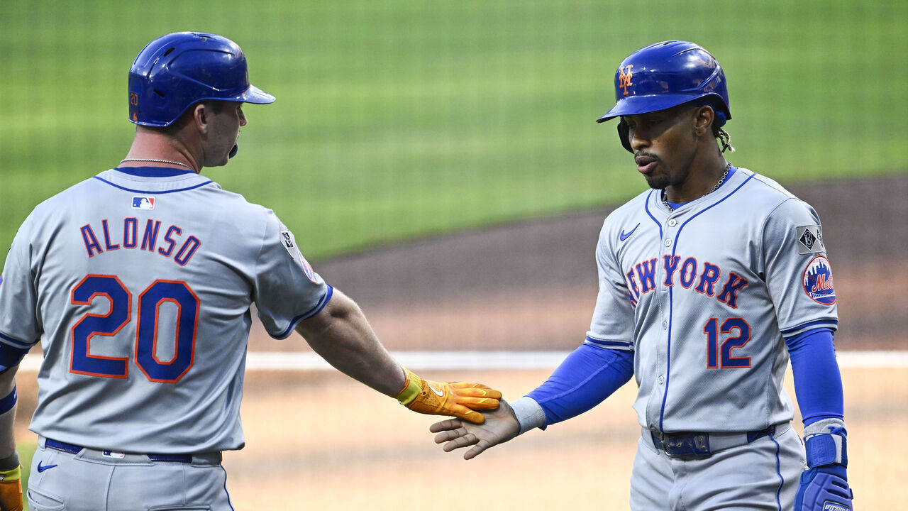SAN DIEGO, CA - AUGUST 22: Francisco Lindor #12 of the New York Mets, right, is congratulated by Pete Alonso #20 after scoring during the first inning of a baseball game against the San Diego Padres, August 22, 2024 at Petco Park in San Diego, California.