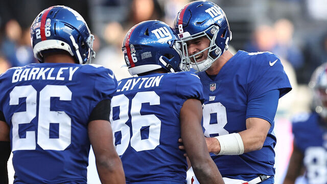 EAST RUTHERFORD, NEW JERSEY - NOVEMBER 13: Daniel Jones #8 of the New York Giants congratulates Darius Slayton #86 after a touchdown during the third quarter in the game against the Houston Texans at MetLife Stadium on November 13, 2022 in East Rutherford, New Jersey.