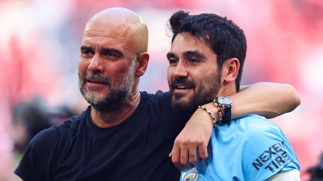 LONDON, ENGLAND - JUNE 3: Pep Guardiola manager of Manchester City celebrates with Ilkay Gundogan after the Emirates FA Cup Final match between Manchester City and Manchester United at Wembley Stadium on June 3, 2023 in London, England.