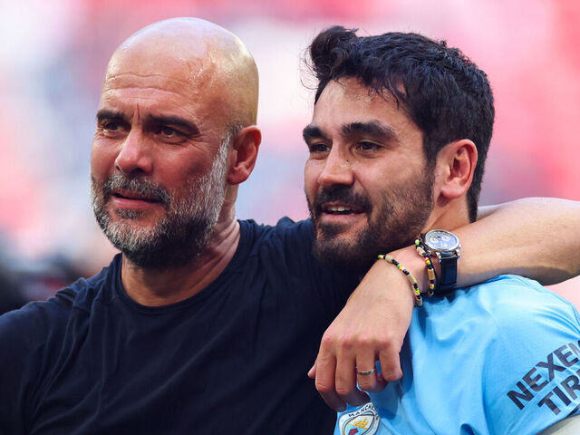 LONDON, ENGLAND - JUNE 3: Pep Guardiola manager of Manchester City celebrates with Ilkay Gundogan after the Emirates FA Cup Final match between Manchester City and Manchester United at Wembley Stadium on June 3, 2023 in London, England.