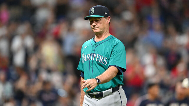 CLEVELAND, OHIO - JUNE 18: Manager Scott Servais #9 of the Seattle Mariners walks off the field after making a pitching change during the eighth inning against the Cleveland Guardians at Progressive Field on June 18, 2024 in Cleveland, Ohio.