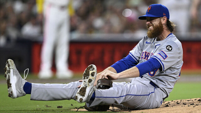 SAN DIEGO, CALIFORNIA - AUGUST 23: Paul Blackburn #58 of the New York Mets reacts after being hit by a batted ball during the third inning against the San Diego Padres at Petco Park on August 23, 2024 in San Diego, California.
