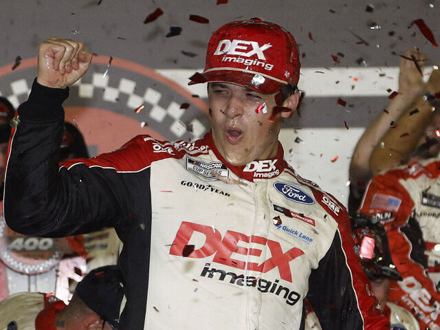 DAYTONA BEACH, FLORIDA - AUGUST 24: Harrison Burton, driver of the #21 DEX Imaging Ford, celebrates in victory lane after winning the NASCAR Cup Series Coke Zero Sugar 400 at Daytona International Speedway on August 24, 2024 in Daytona Beach, Florida.