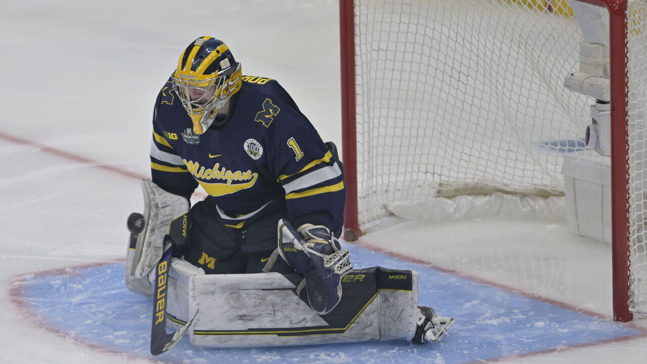 TAMPA, FL - APRIL 06, 2023: Michigan goalie Erik Portillo (1) makes a save during the NCAA Division I Men's Ice Hockey Frozen Four game between the Quinnipiac Bobcats and the Michigan Wolverines on April 06, 2023, at Amalie Arena in Tampa, FL.