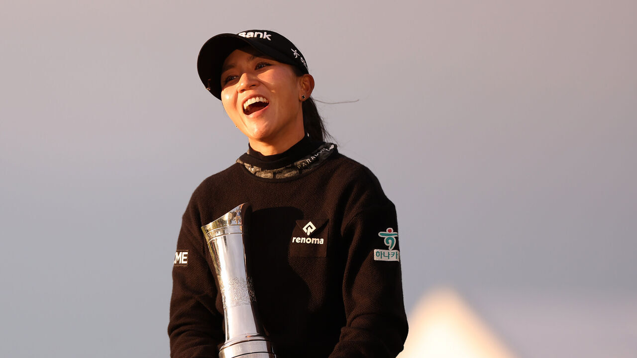 ST ANDREWS, SCOTLAND - AUGUST 25: Champion, Lydia Ko of New Zealand celebrates with the AIG Women's Open trophy following Day Four of the AIG Women's Open at St Andrews Old Course on August 25, 2024 in St Andrews, Scotland.
