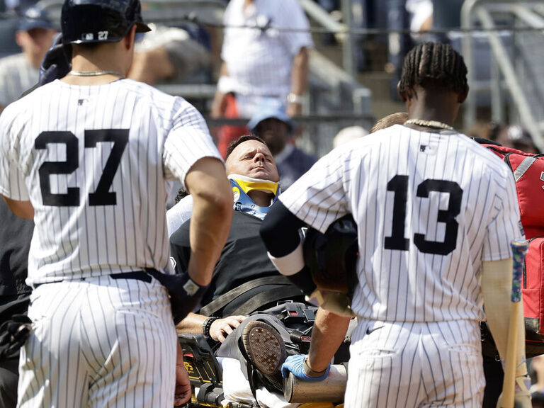 Umpire carted off after getting hit in neck by Stanton's broken bat ...