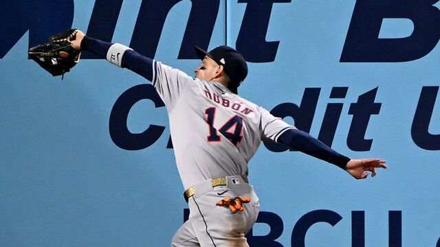 BALTIMORE, MARYLAND - AUGUST 25: Mauricio Dubón #14 of the Houston Astros makes a running catch on a fly ball off the bat of Ramón Urías of the Baltimore Orioles in the seventh inning at Oriole Park at Camden Yards on August 25, 2024 in Baltimore, Maryland. Dubón came out of the game after crashing into the wall on the play.