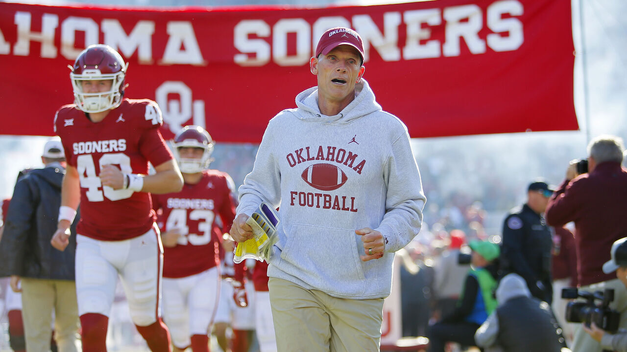 NORMAN, OKLAHOMA - NOVEMBER 24: Head coach Brent Venables of the Oklahoma Sooners runs onto the field for a game against the TCU Horned Frogs at Gaylord Family Oklahoma Memorial Stadium on November 24, 2023 in Norman, Oklahoma. Oklahoma won 69-45.